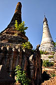 Inle Lake Myanmar. Indein, a cluster of ancient stupas  ruined and overgrown with bushes, just behind the village.